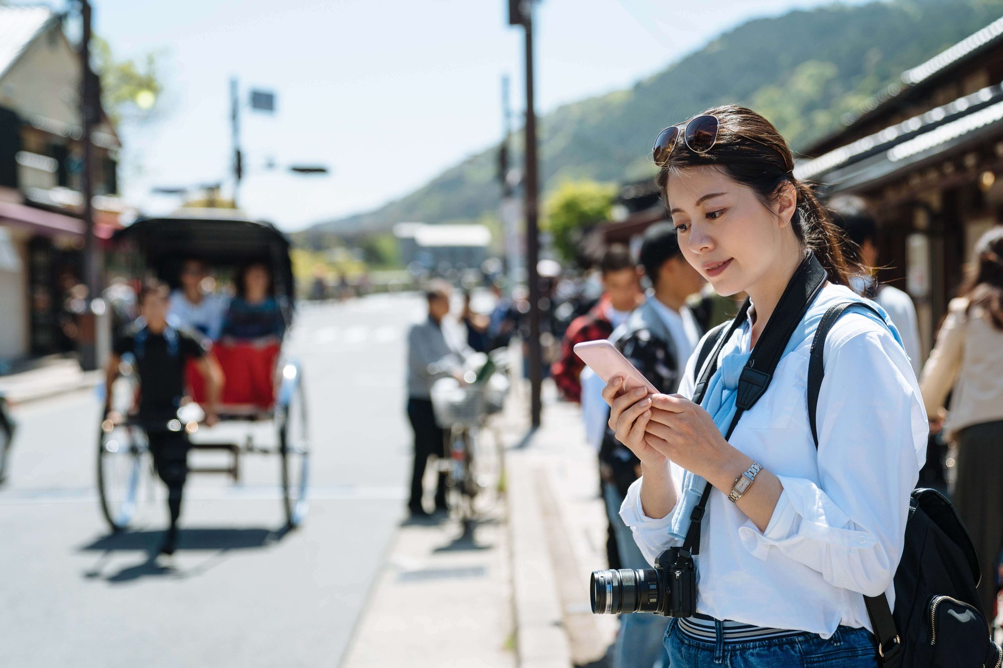 Woman travelling with phone in hand