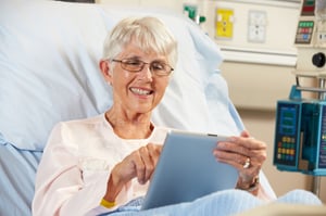 Lady using tablet in hospital