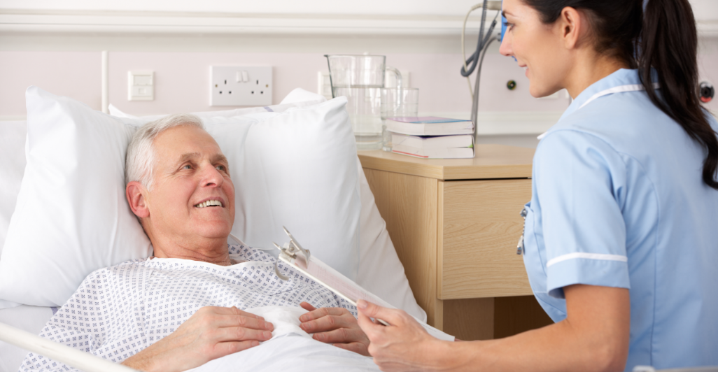 Man smiling in hospital bed